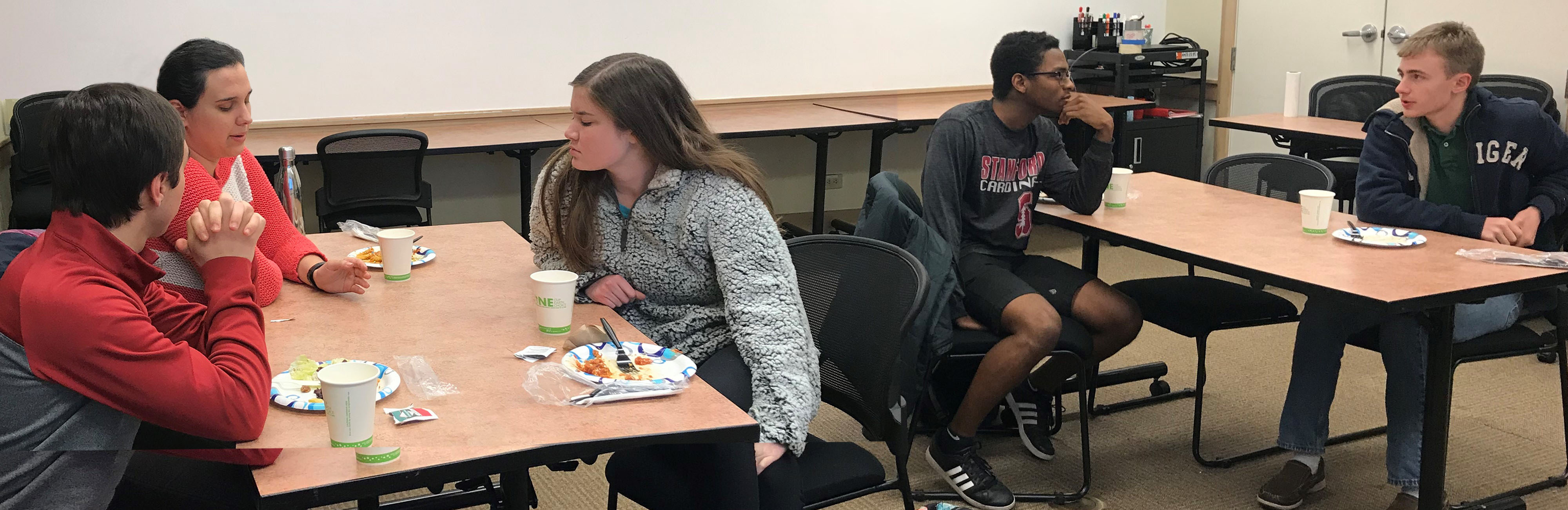 Students talking over dinner at the Haas Center